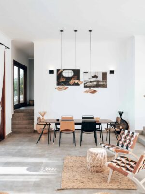 Stylish dining area showcasing modern minimalist design and unique hanging decor.